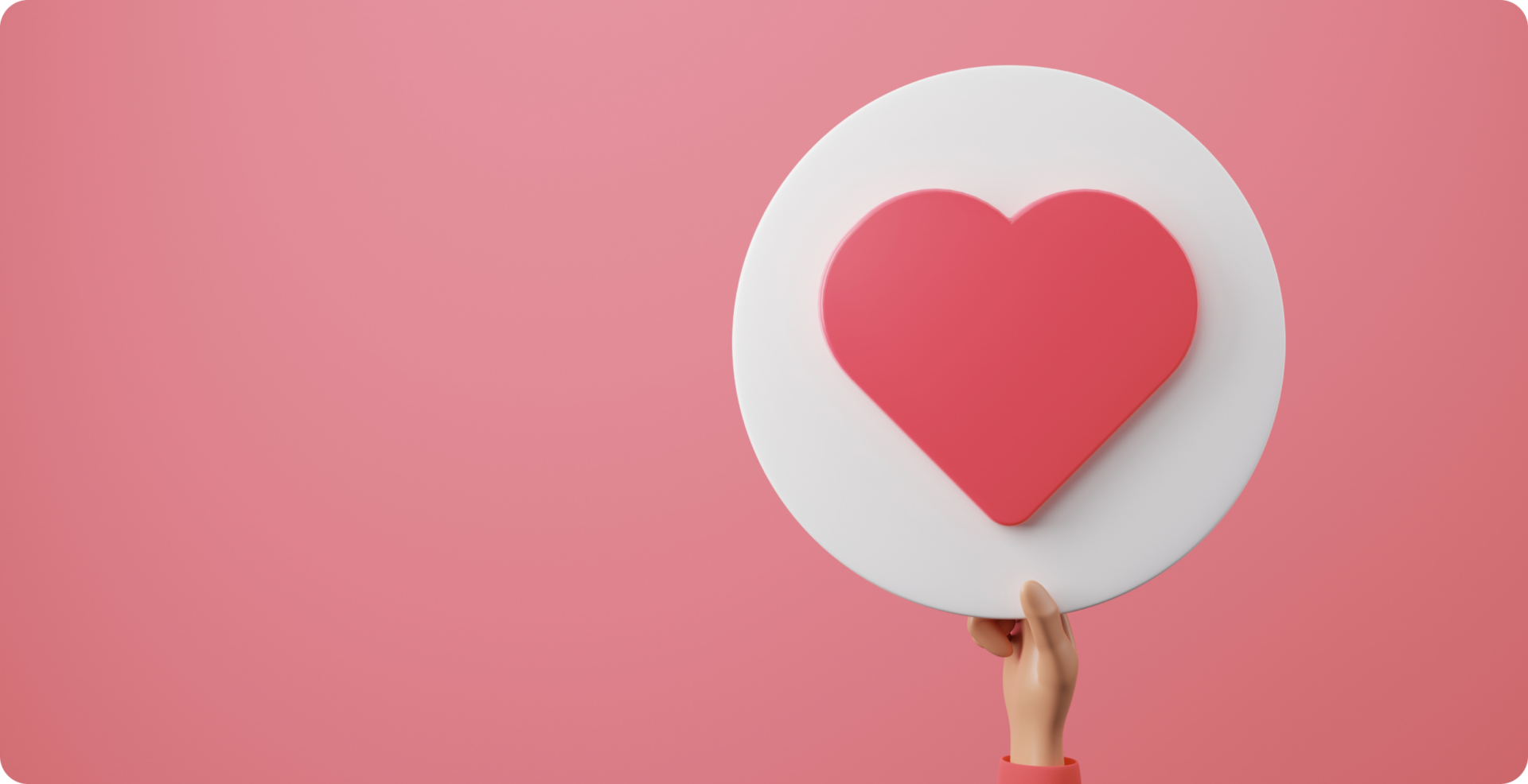 ピンクの背景に、ピンクのハートが貼り付けられた白く丸い円盤上の物を右手で持っている様子